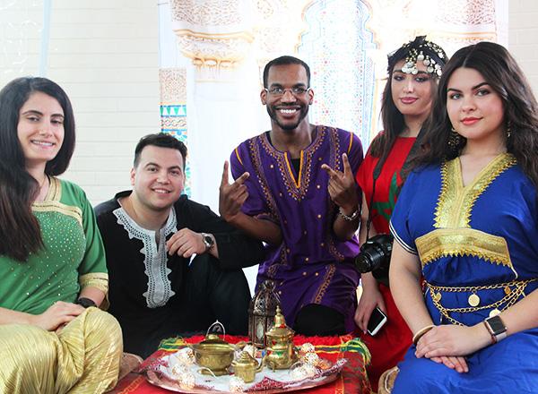 A group of diverse students drinking tea at Globe Fest.