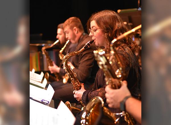HFC musicians playing saxophones at a concert.