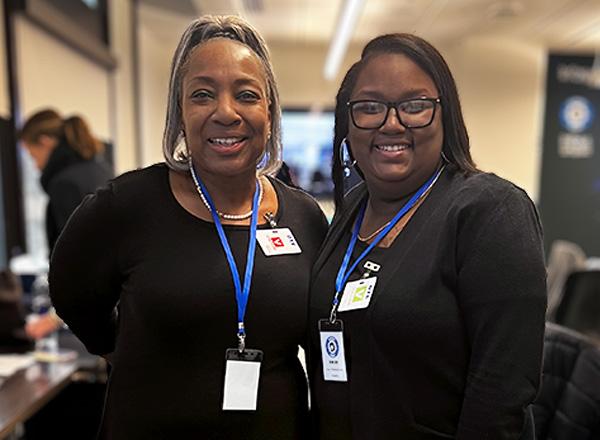 Left, Marrci Conner with student, right, Olivia Cato. Both dressed in black. 