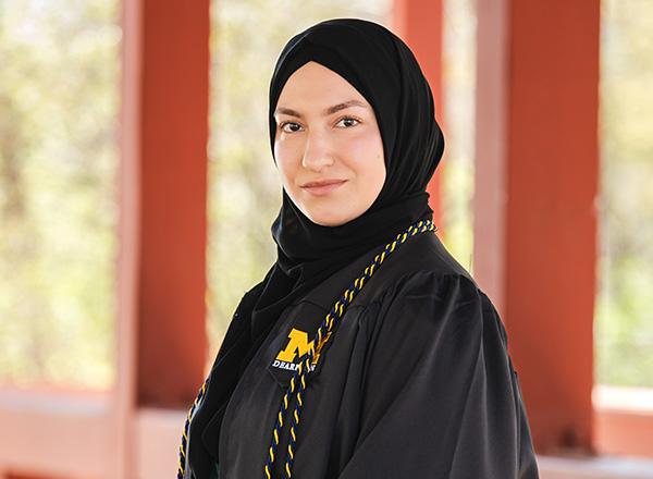 Chaymaa Nehme headshot, in her graduation gown.