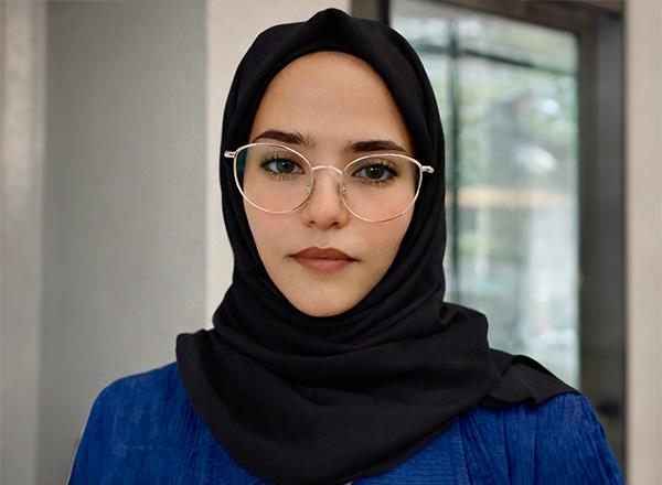 Headshot of Ola Oshaish.