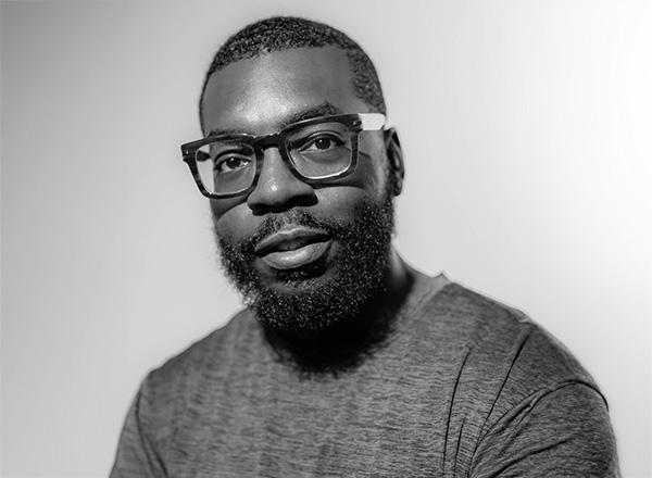 Donovan Shaffer headshot. In black and white. 