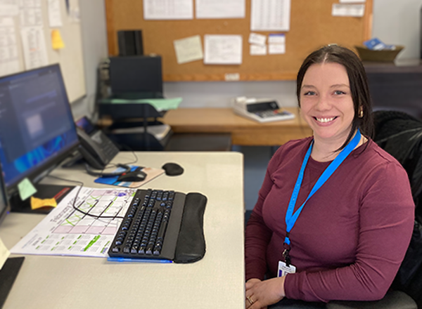 Jamie Monberg at her desk in the Mailroom. 