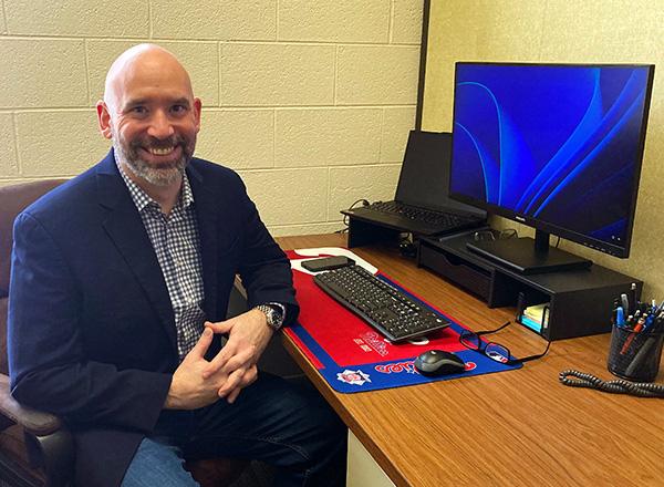 Seth Amadei at his desk. 