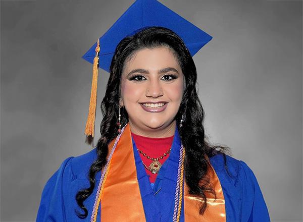Ayah Naimi headshot in cap and gown.