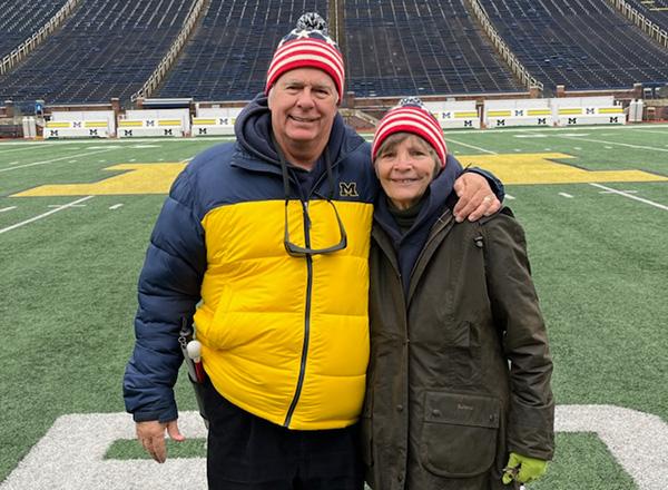Dennis and Donna Ringle on the U of M football field. 