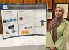 Afrah Asker, an Honors student, presenting research at the 2023 symposium.