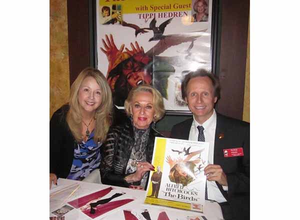 Sharon Pearl Picking (left) and her husband Patrick Picking (right) flank Tippi Hedren, the lead actress in Alfred Hitchcock's "The Birds," at the Redford Theatre in Detroit. 