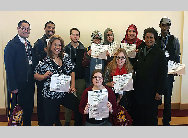 The Mirror News staff and advisors proudly display their certificates and awards. 