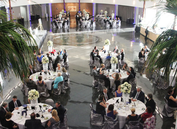 Overhead shot of president gala, with people sitting at decorated tables