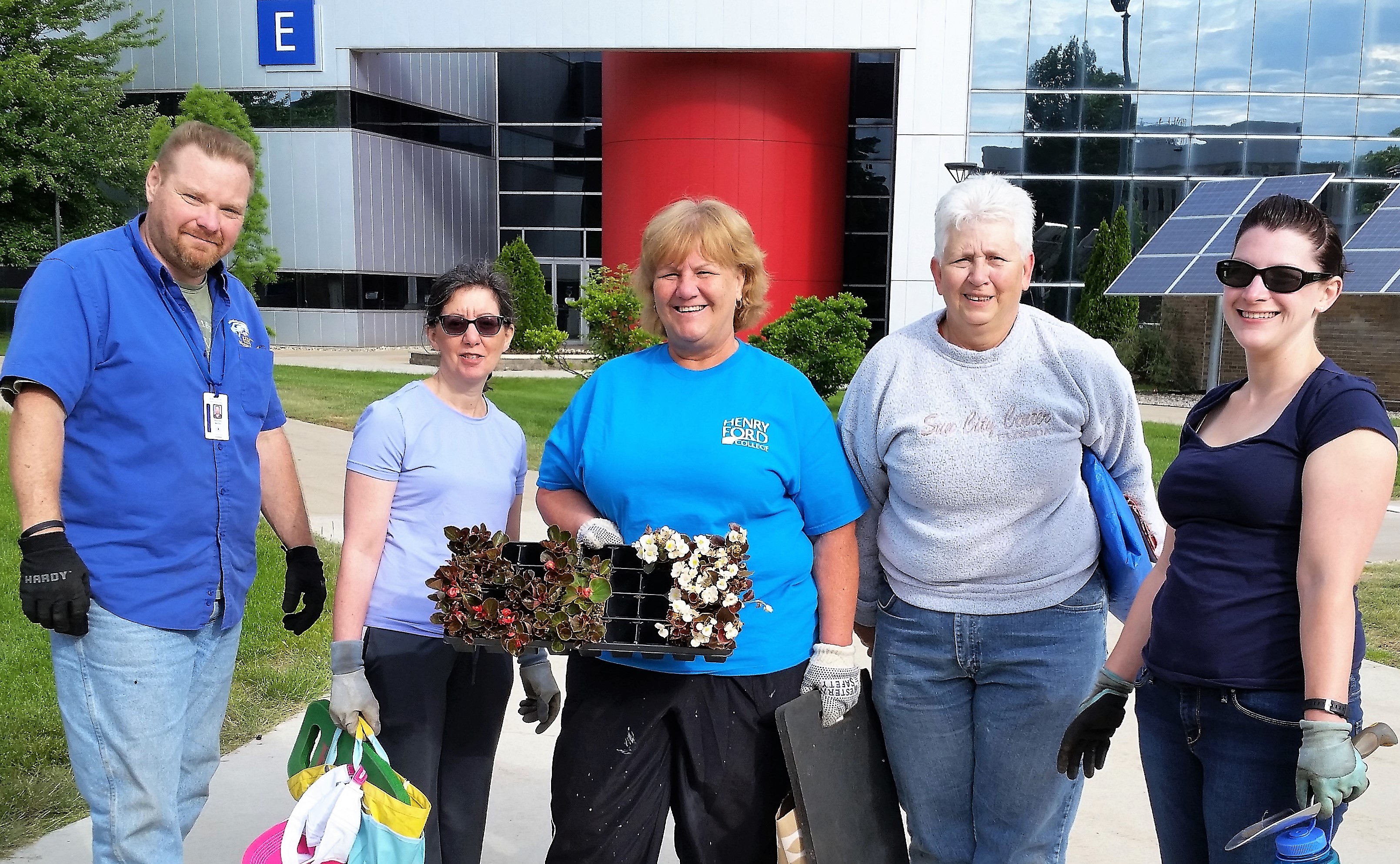 5 HFC employees dressed for gardening