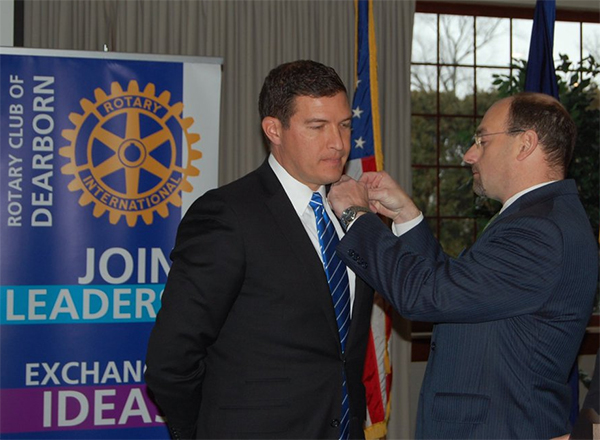President Kavalhuna being pinned by fellow rotarian, and HFC Trustee, James Thorpe.
