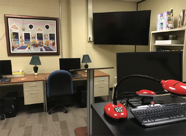 Photo of public speaking lab, screens, equipment