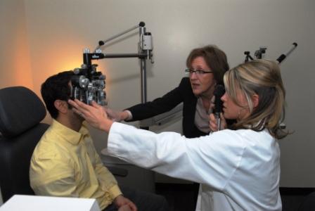 An HFCC student learns how to conduct eye exam